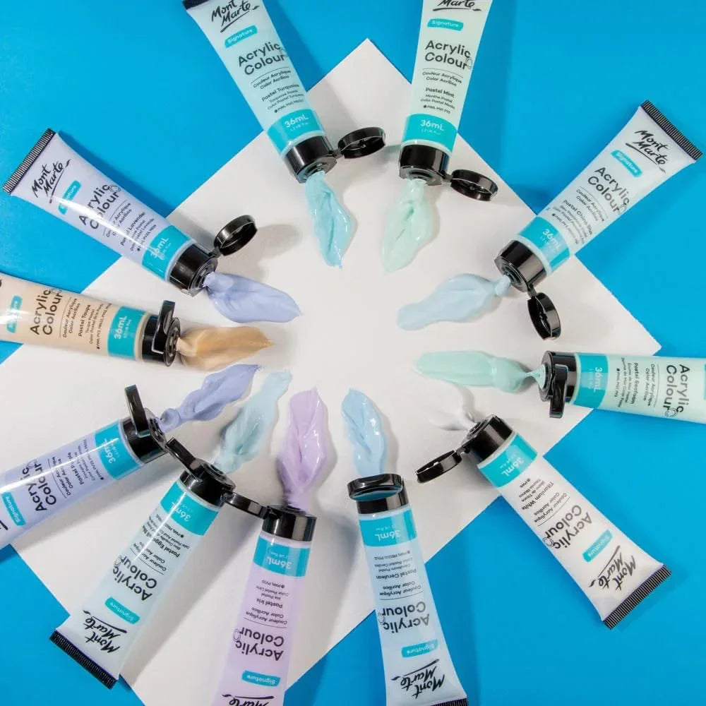 Mont Marte acrylic colour paint tubes arranged in a circle with pastel paint on white background