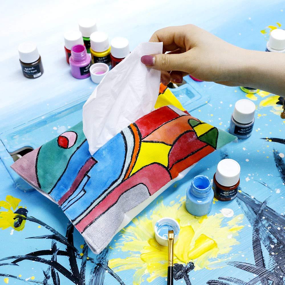 Hand pulling tissue from colorful hand-painted tissue box, Mont Marte acrylic paints on table